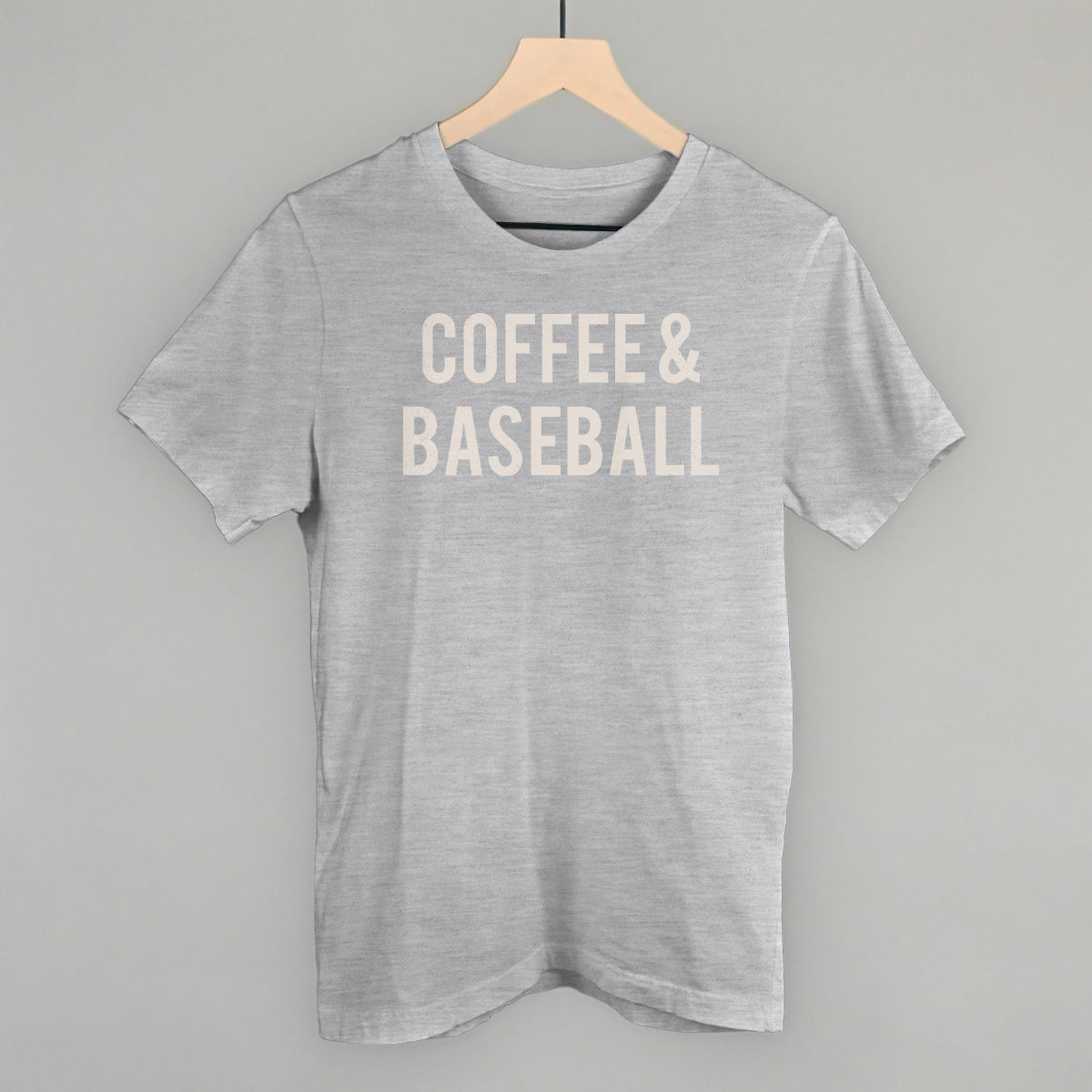 Collection of Gray comfort colors t-shirt with 'COFFEE & BASEBALL' text on a hanger against a gray background in a gallery layout