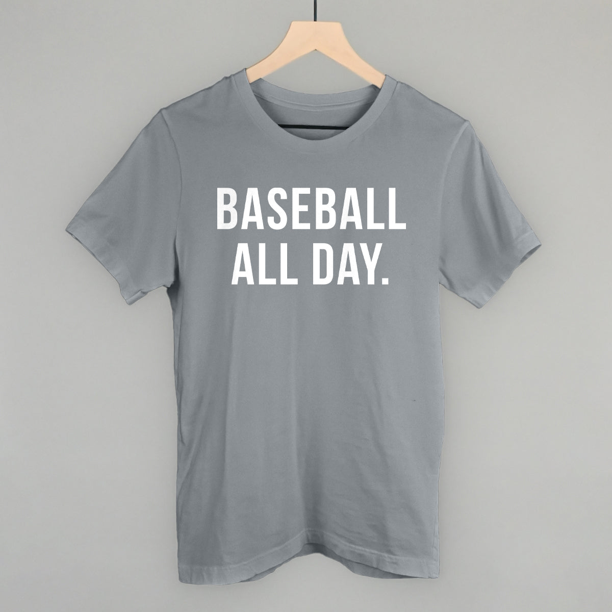 Collection of Gray t-shirt with 'BASEBALL ALL DAY.' text on a hanger against a gray background in a gallery layout