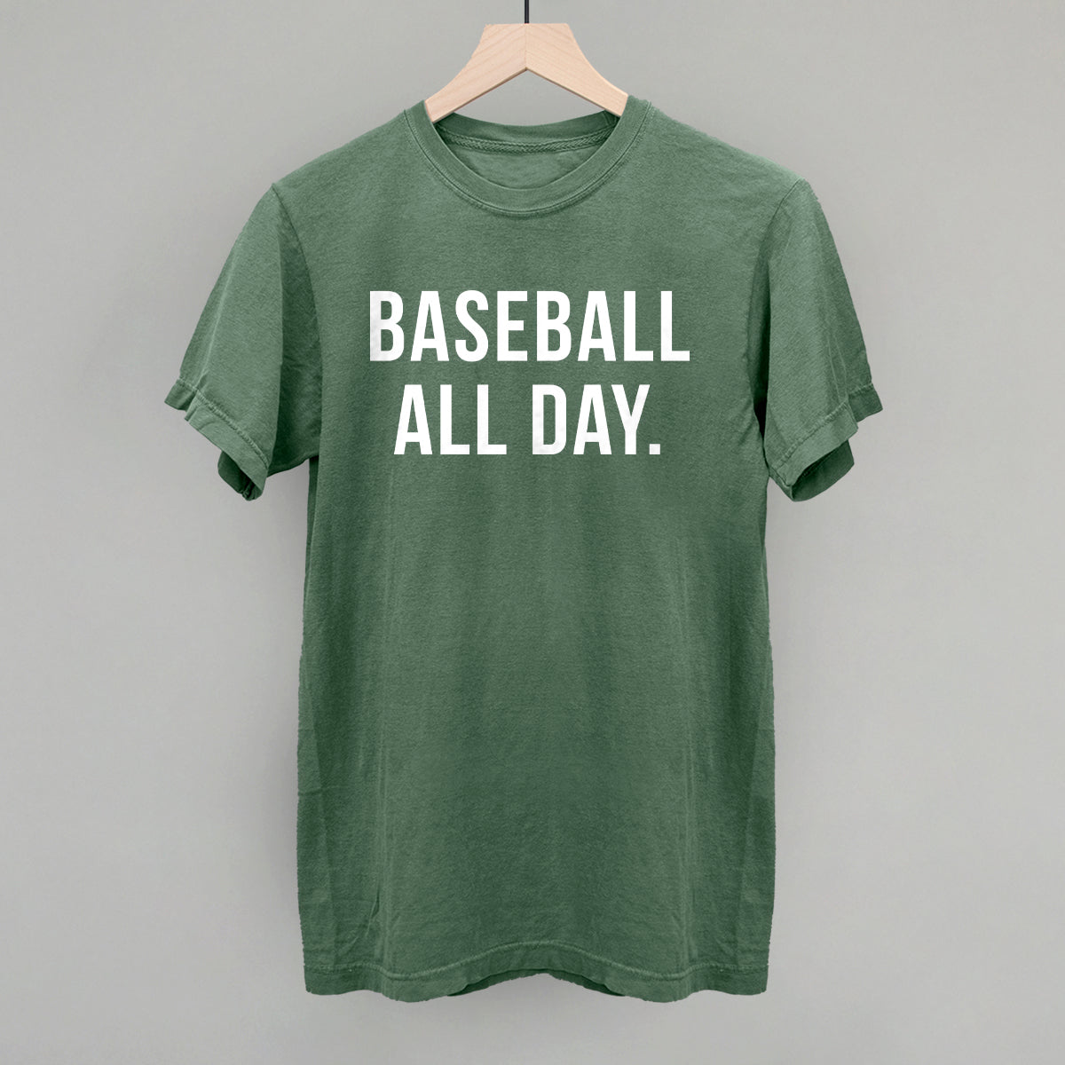 Green t-shirt with 'BASEBALL ALL DAY.' text on a gray background