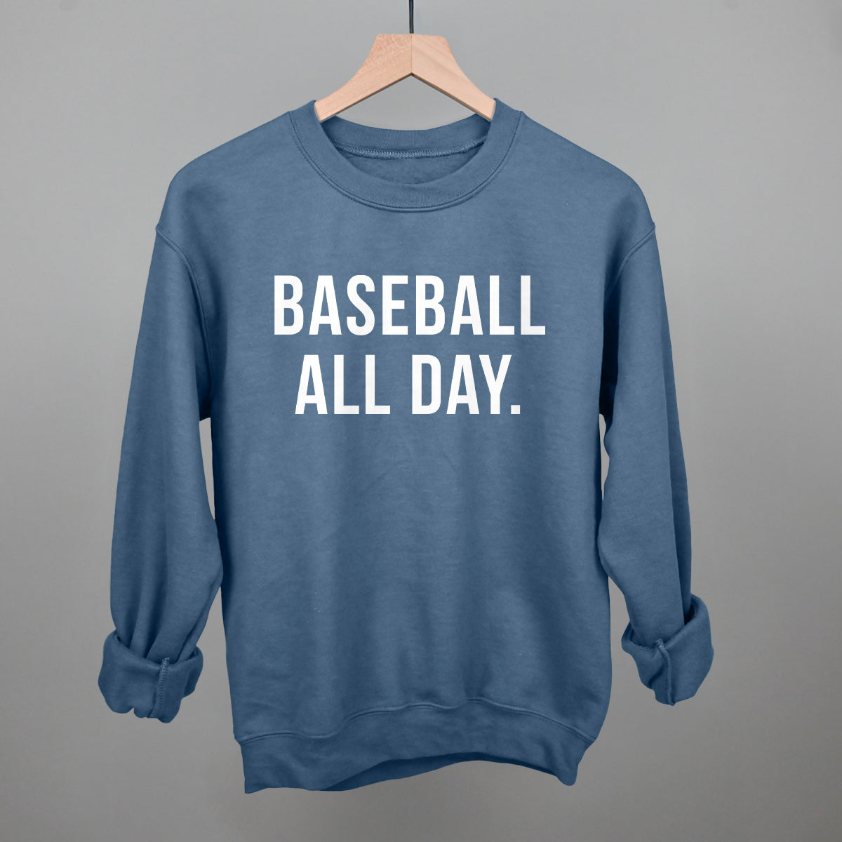 Blue sweatshirt with 'BASEBALL ALL DAY.' text on a gray background