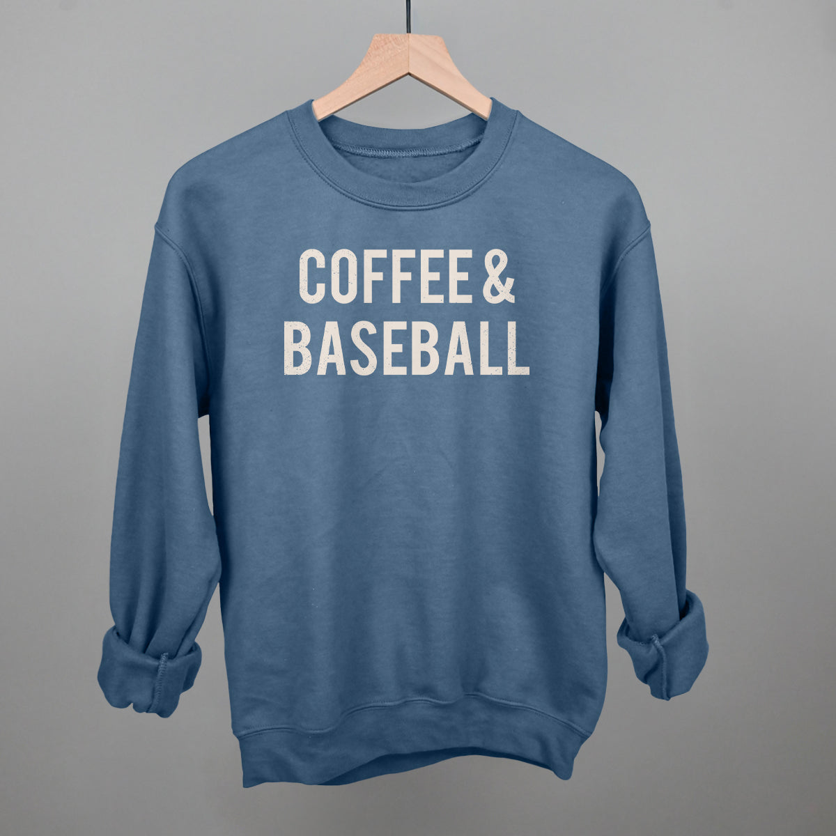Collection of Blue comfort colors sweatshirt with 'COFFEE & BASEBALL' text on a gray background in a gallery layout