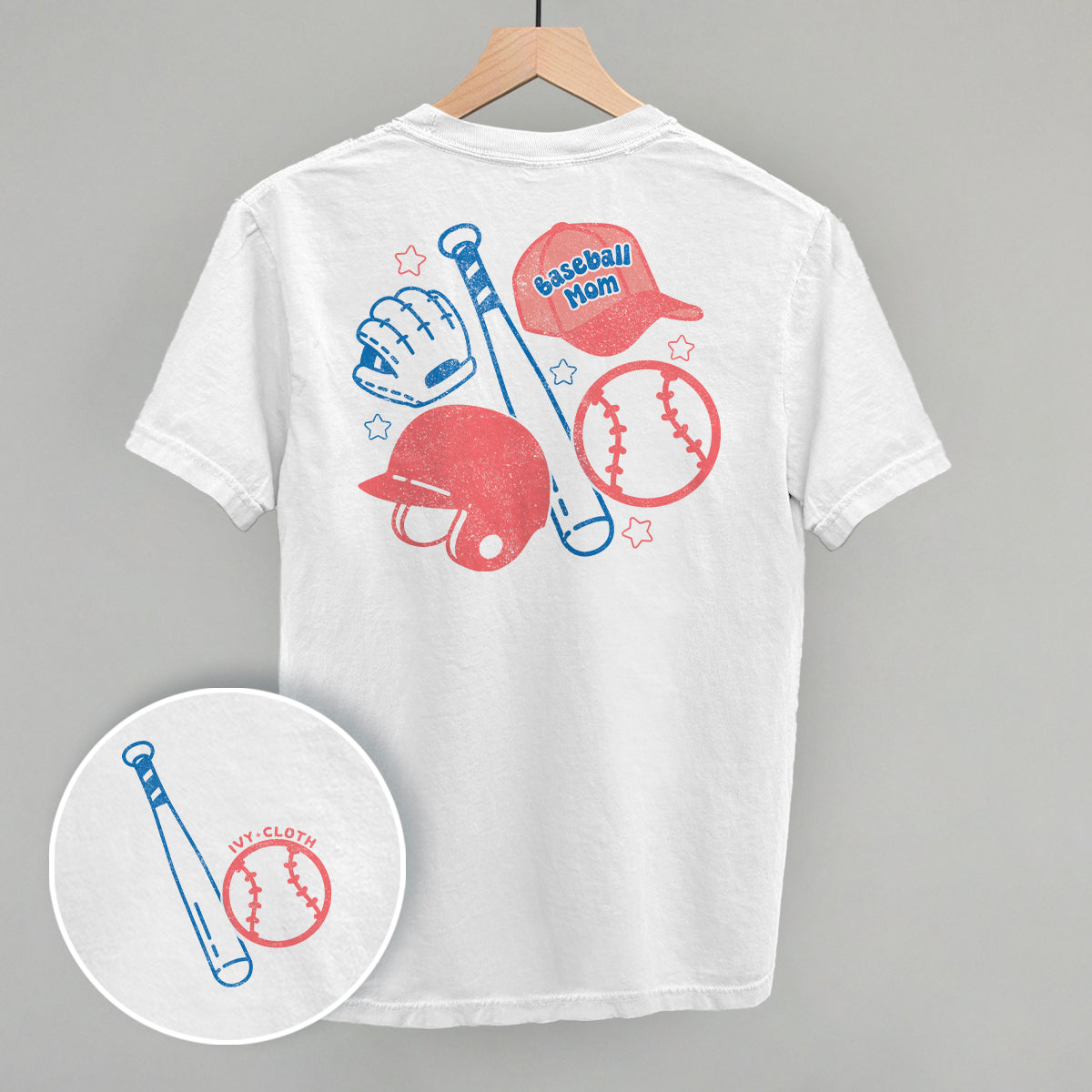 White t-shirt with baseball mom-themed graphics on a gray background