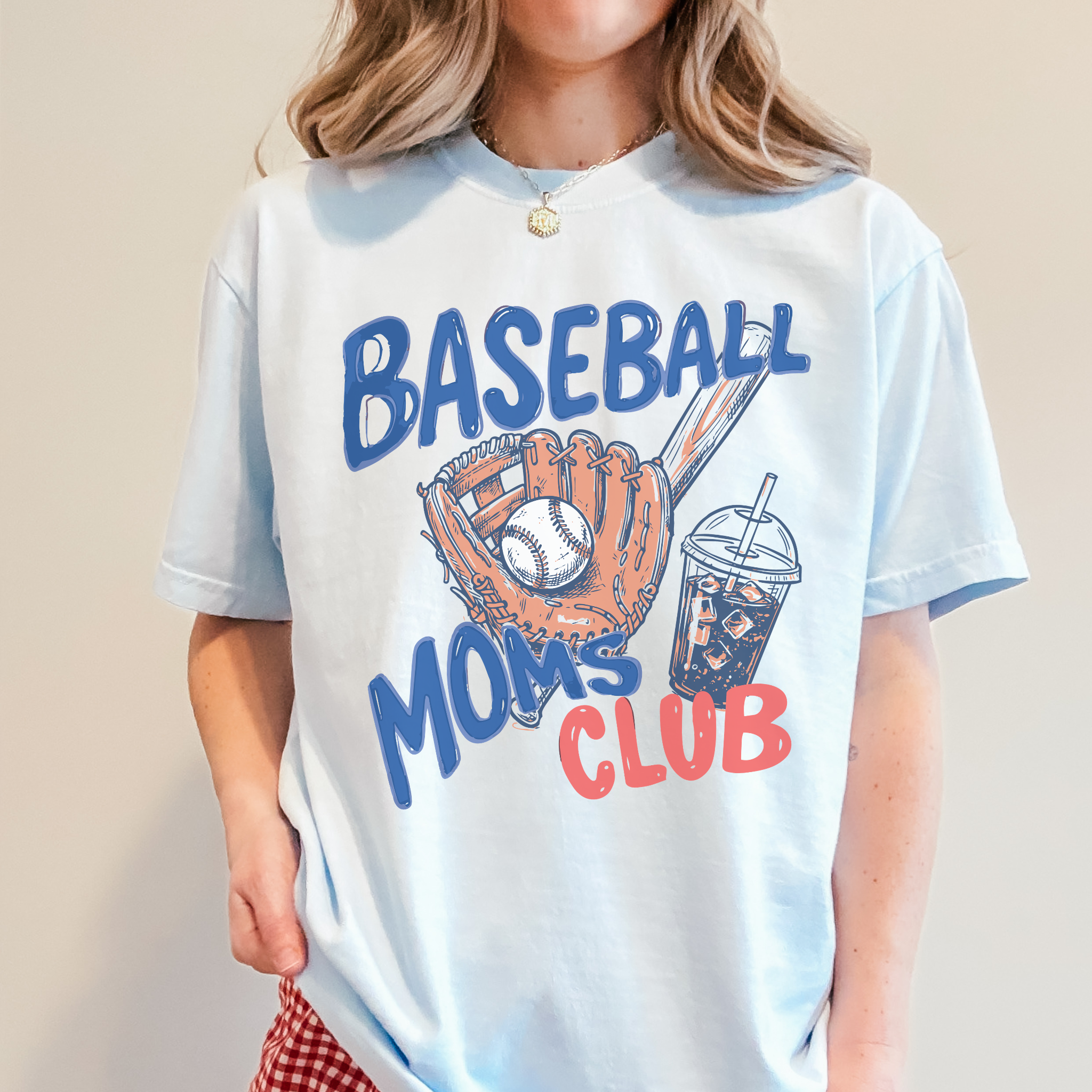 Collection of Person wearing a t-shirt with 'Baseball Moms Club' design on a plain background in a gallery layout