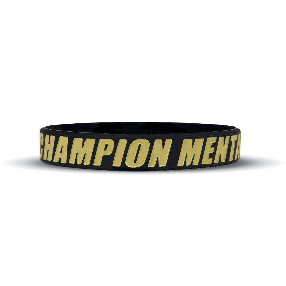 Black wristband with 'Champion Mentality' text on a white background