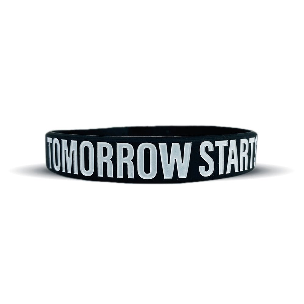 Collection of Black wristband with 'TOMORROW STARTS' text on a white background in a gallery layout