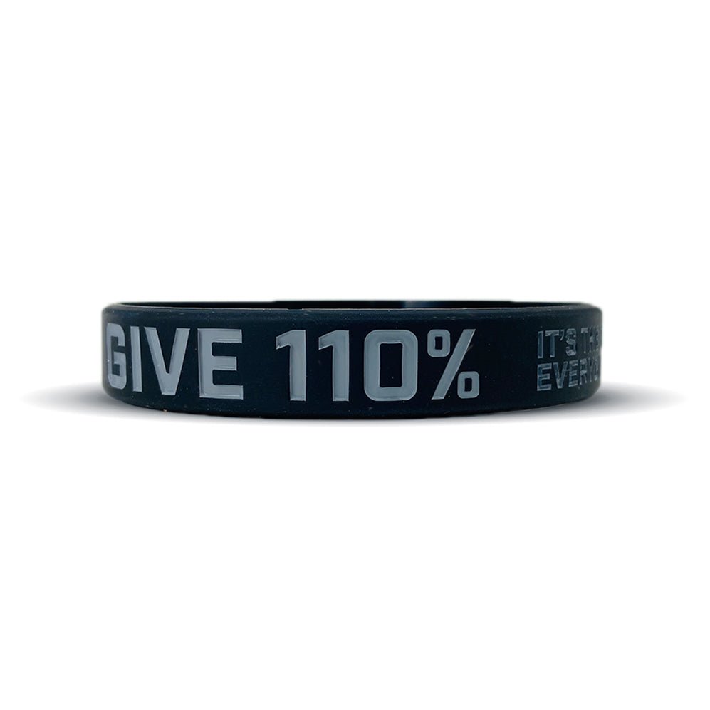 Black wristband with 'GIVE 110%' text on a white background