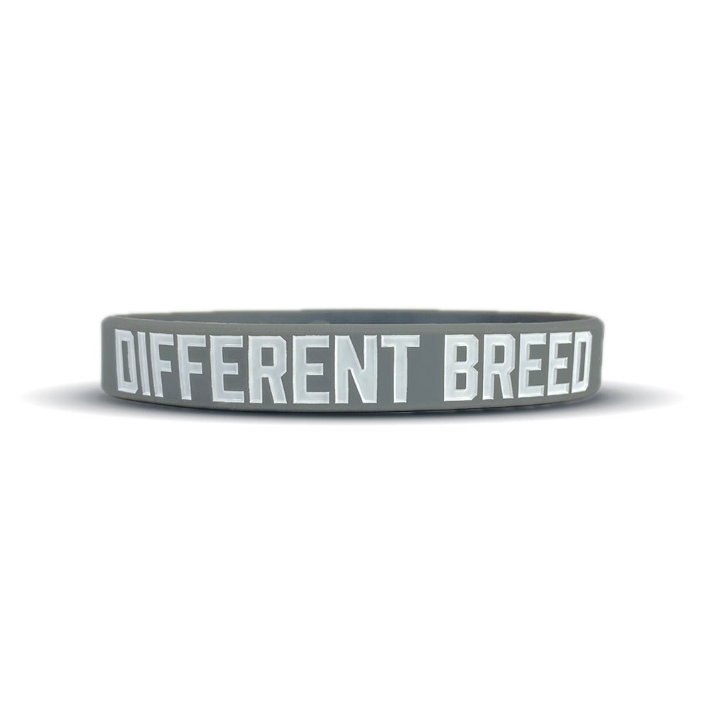Gray wristband with 'DIFFERENT BREED' text on a white background