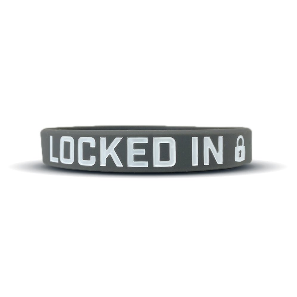 Collection of Gray wristband with 'LOCKED IN' text on a white background in a gallery layout