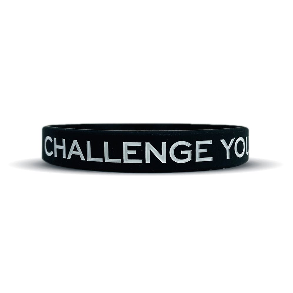 Black wristband with 'CHALLENGE YOU' text on a white background