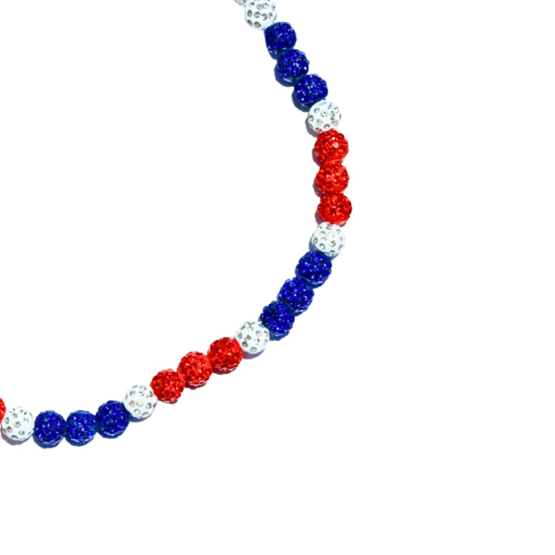 Necklace with red, blue, and white beads on a white background